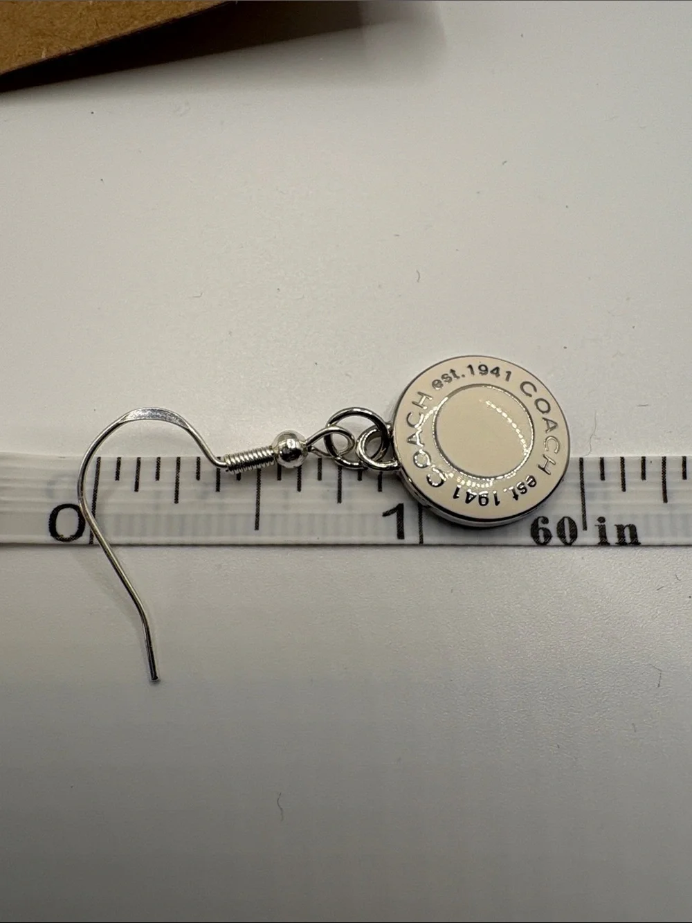 COACH Silver-Tone Earrings with White Logo Discs - Picture 3 of 4